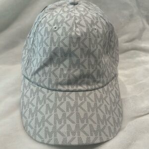 NWT Michael Kors Signature fabric gray/black cap with adjustable back.